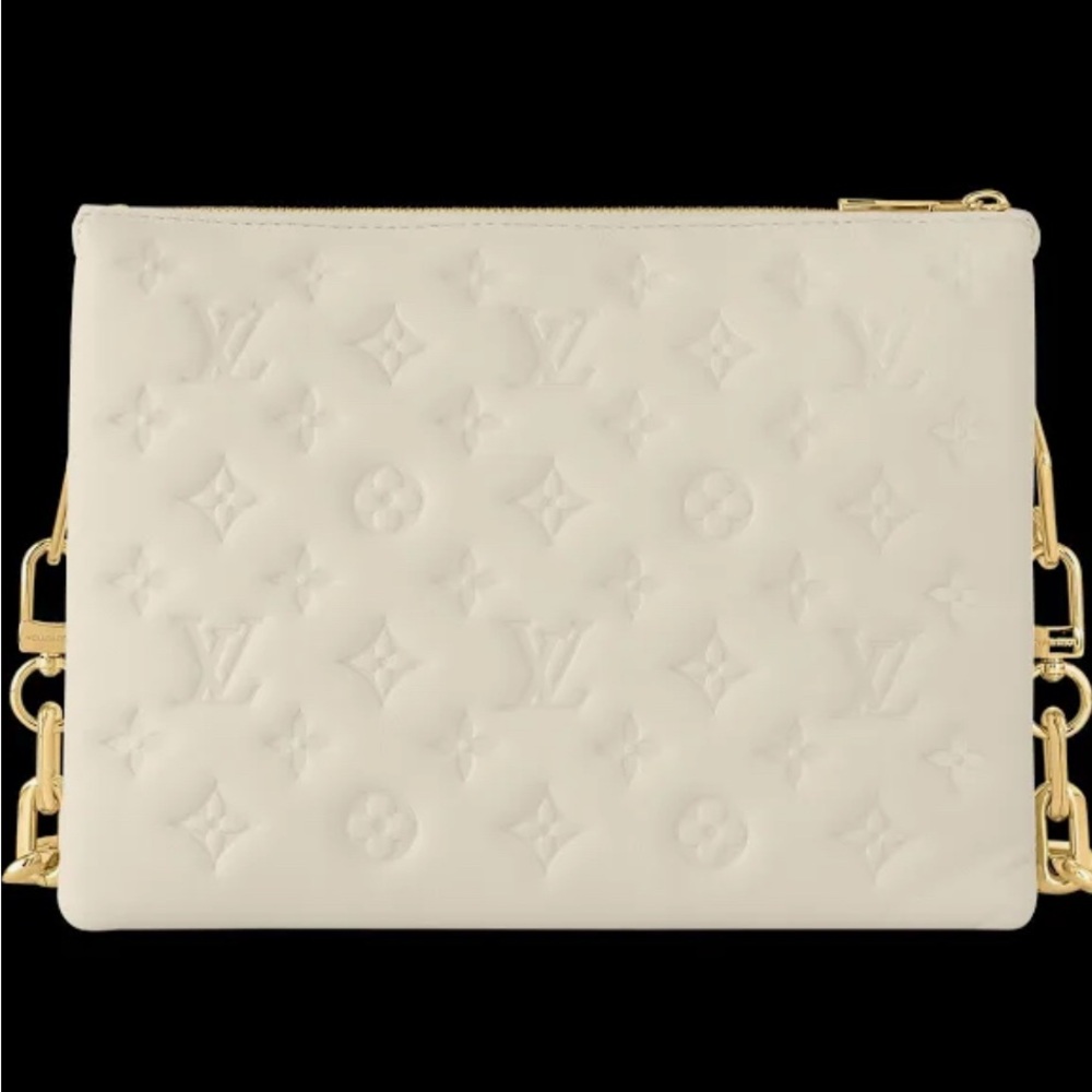 Cream colored small hand bag